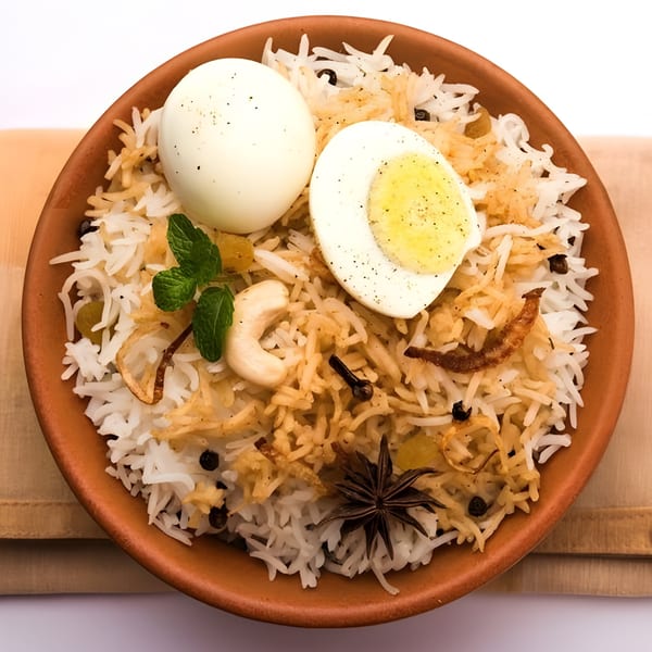 Spice Venue's egg biryani, a flavorful Indian rice dish with whole and halved boiled eggs.