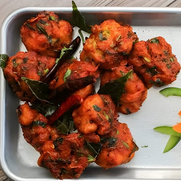 Spice Venue's chicken pakora, crispy fried chicken pieces with curry leaves and red chilies.